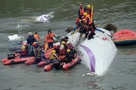 Taiwan plane cartwheels into river after take-off, killing at least 19